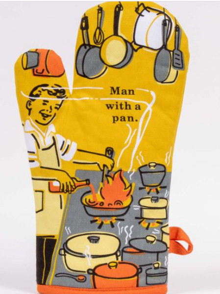 Golden-yellow oven mitt with 1950s-style illustration of a man cooking at a stove with metal pots and pans hanging overhead. Text reads "Man with a pan."