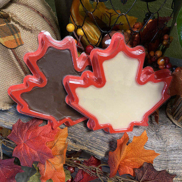 Maple leaf shaped chocolate and white fudge in a rustic autumn display from Uranus Fudge Factory
