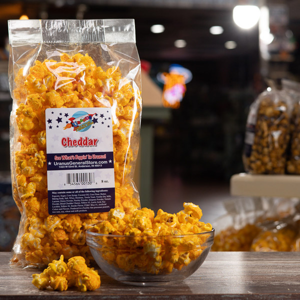 Uranus Cheddar Popcorn package and bowl.