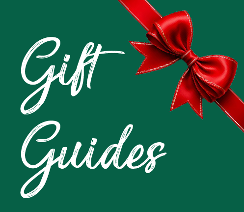 Easter themed pyramid with flower tealight candle holders and three rabbits on a small table with a coffee pot, cup and plate with pastry and a vase with daffodils. 