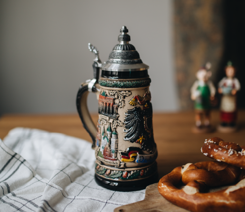 Traditional earthenware beer stein with pewter lid