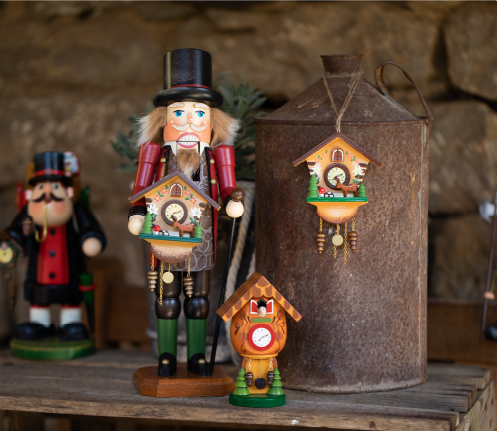 cuckoo clock gifts including a clock seller nutcracker, cuckoo clock ornament, and cuckoo clock smoker