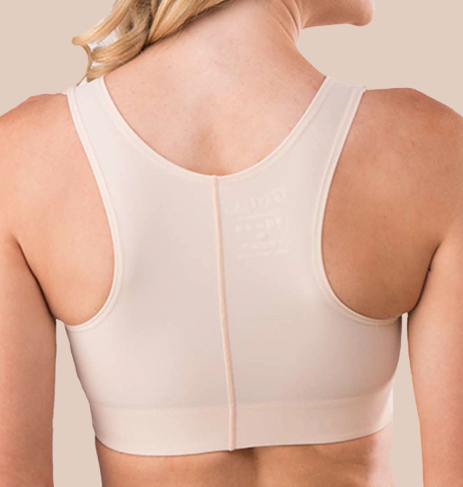 Adjustable hook-and-eye shoulder straps provide a personalised fit and optimal comfort during recovery.​