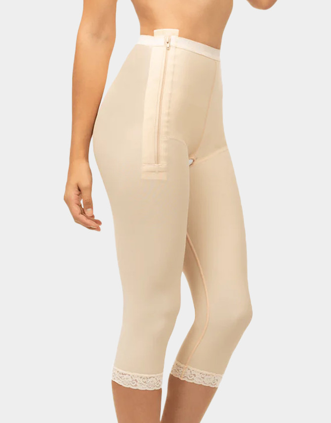 Low-waist below-the-knee compression girdle with dual padded side zippers for secure post-operative support.