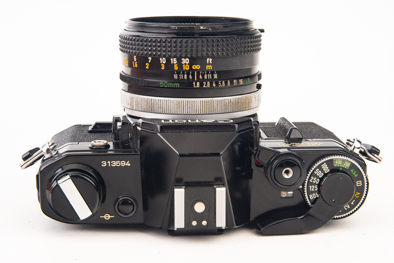 【M2039】 Canon AE-1 + Canon FD 50mm 1.8 Canon AE-1 50mm FD f/1.8 & 35-200mm f/3.8-5.3 Lens – Film