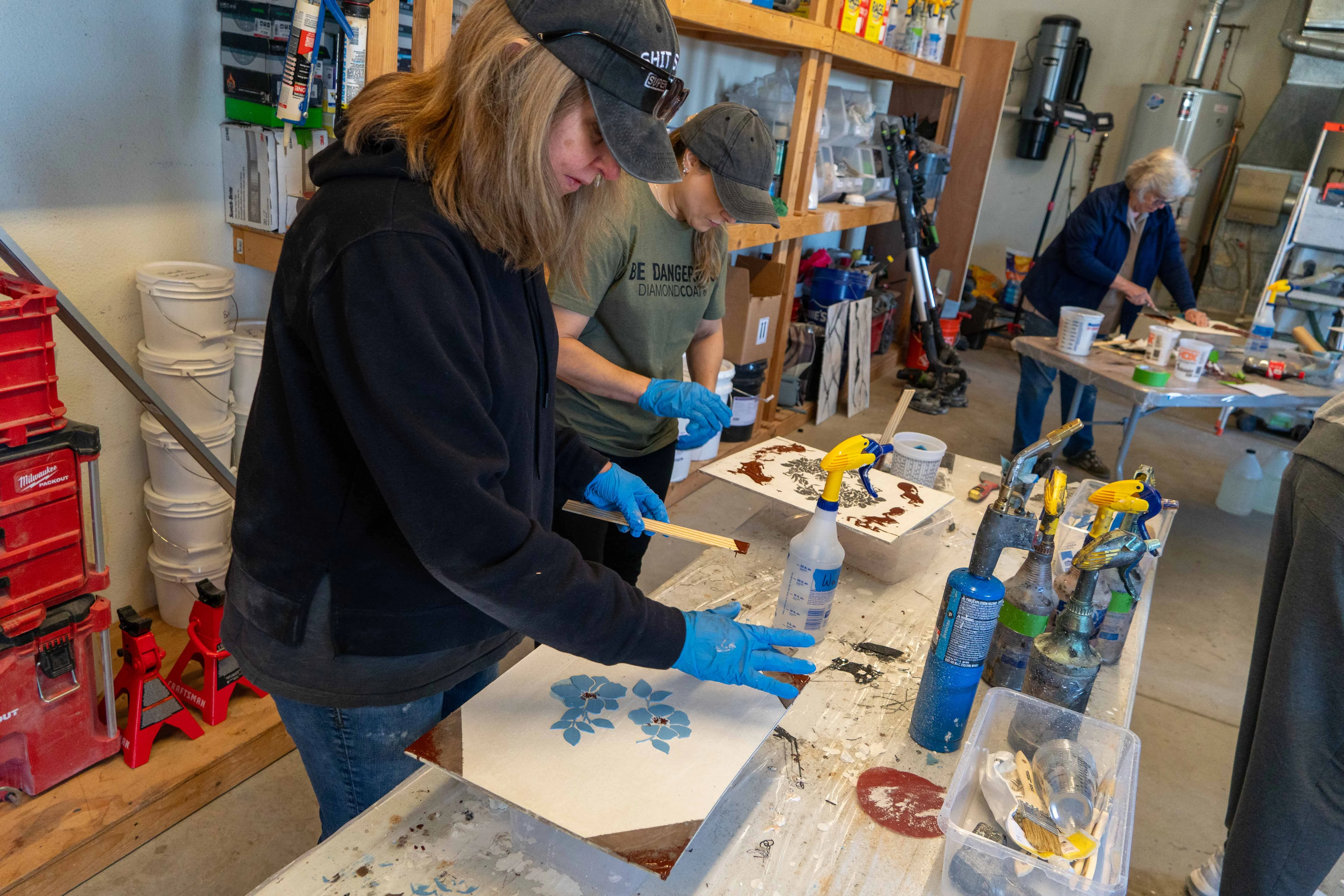 Workshop students working on a real installation during a Diamond Coat class