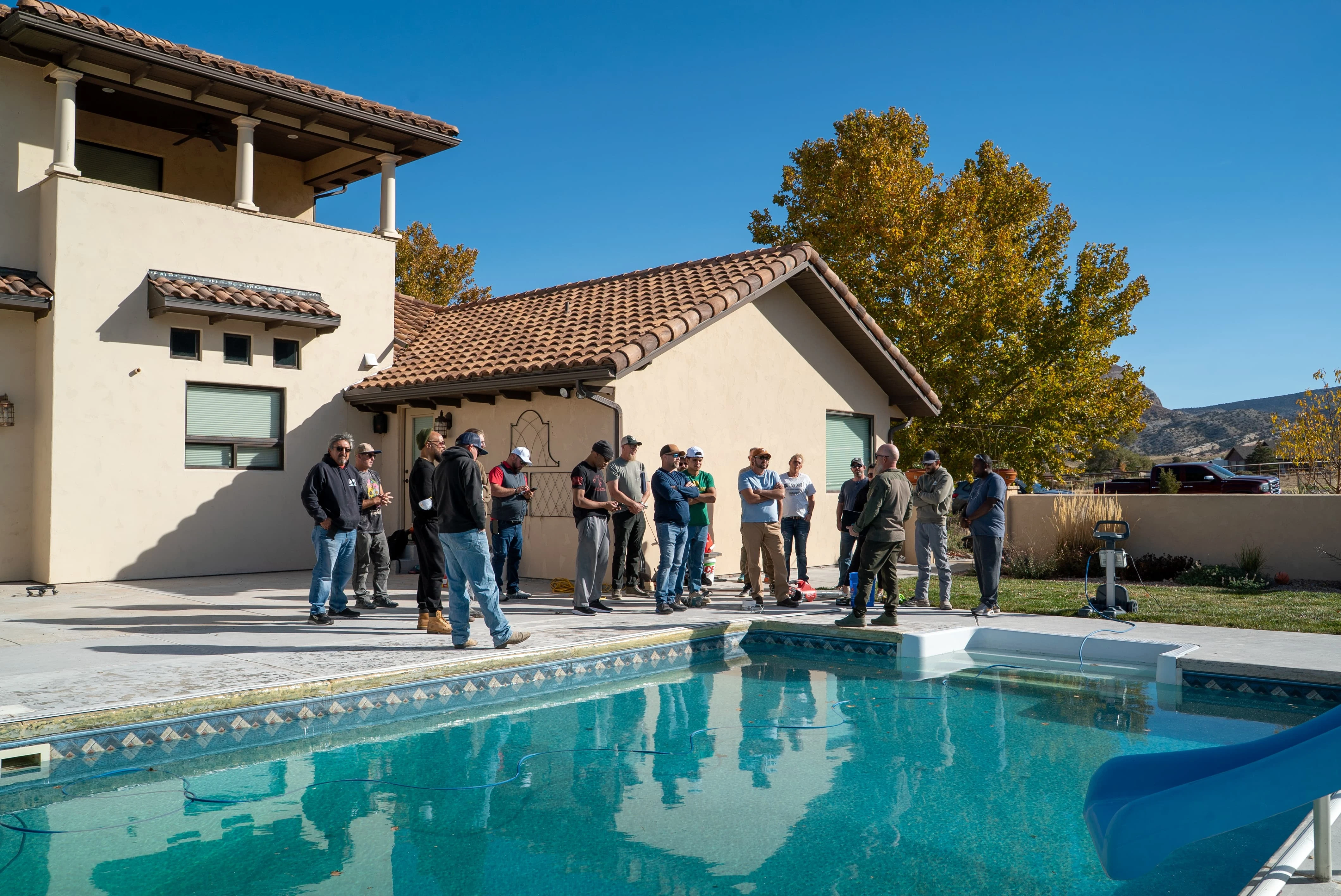 Masterclass students at an active pool deck jobsite in Grand Junction during a Countertop Epoxy workshop