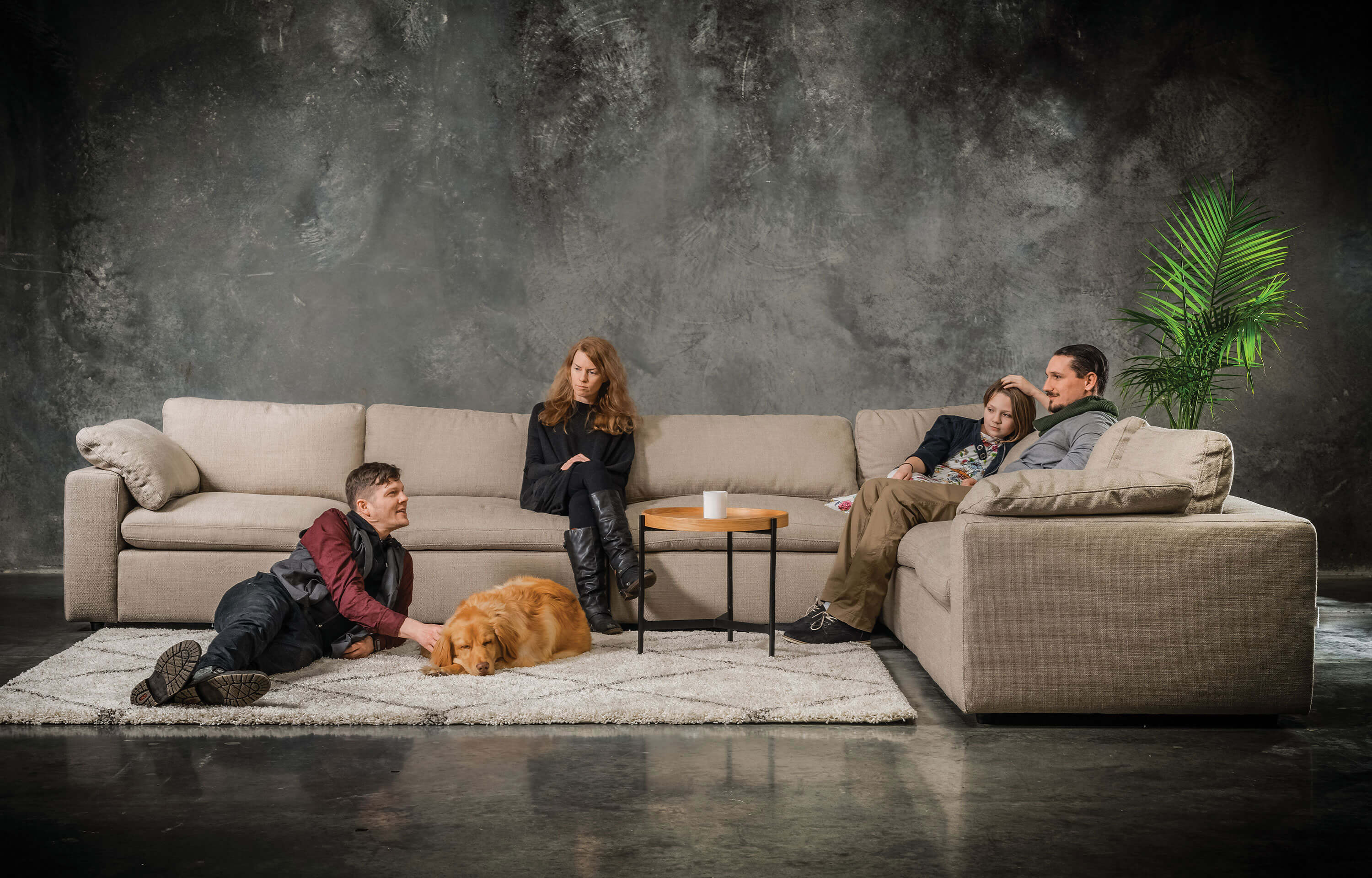 	People sitting on a sectional sofa


