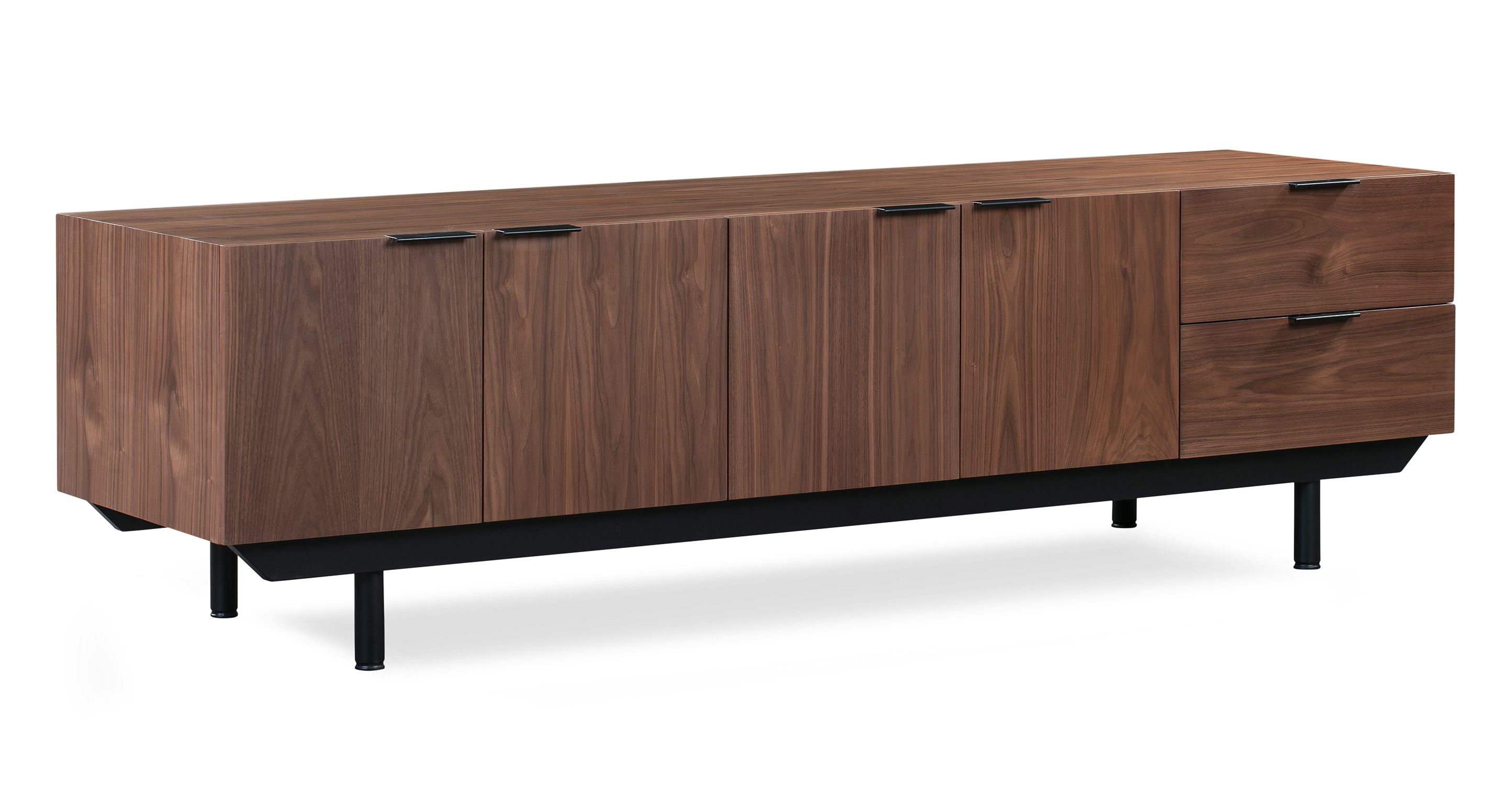 The Structure credenza has a walnut wood exterior and drawer. To the left and center are two sets of cabinet doors with black top-mount pulls. On the right are two pull-out drawers with top mount pulls. The frame is black and metal, and has four round feet. 