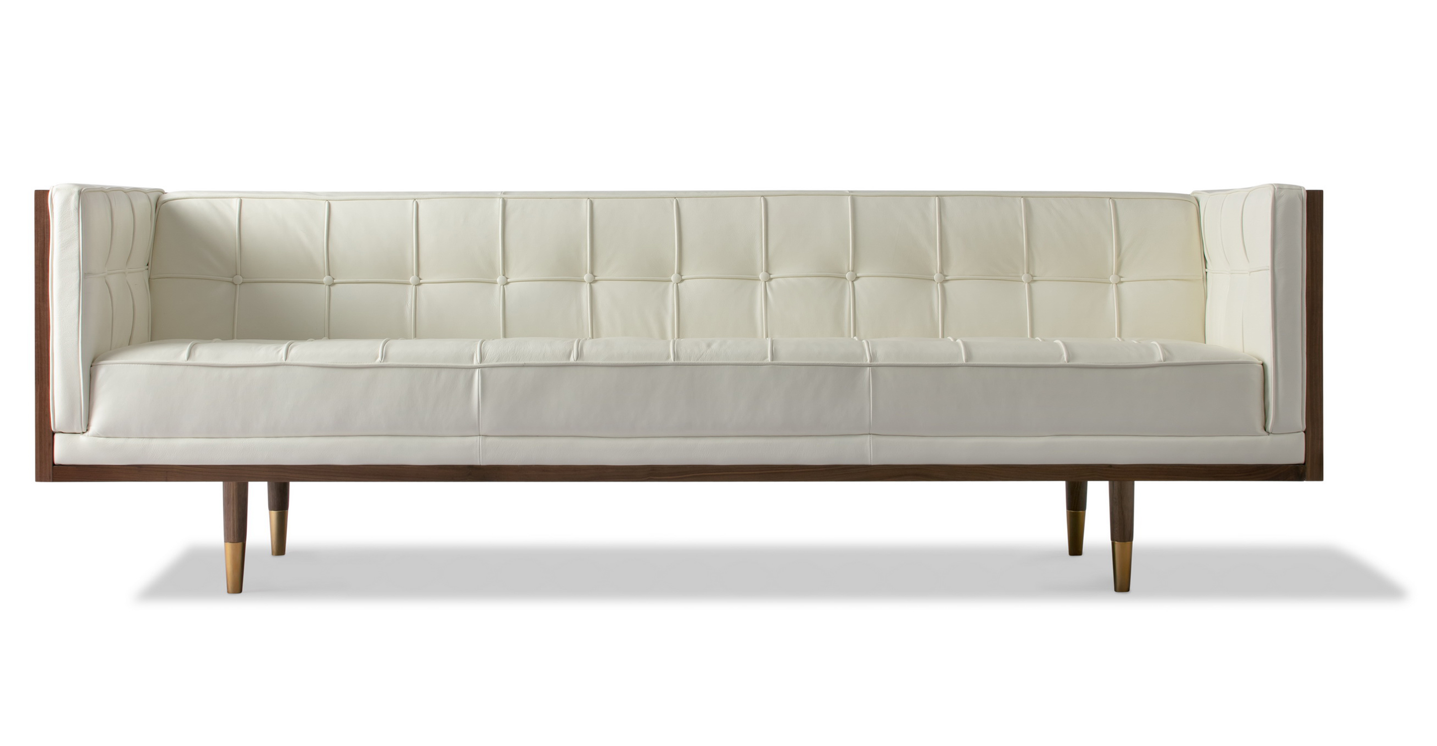 Woodrow 3 Seat Sofa in White Leather has fixed seat and back cushions. There is button tufting on the back cushion, sides of the sofa and on the seat cushions. The frame and legs are walnut colored. The legs have brass colored ferrules on the ends. The back and outsides of the sectional are wooden. The leather color is white.