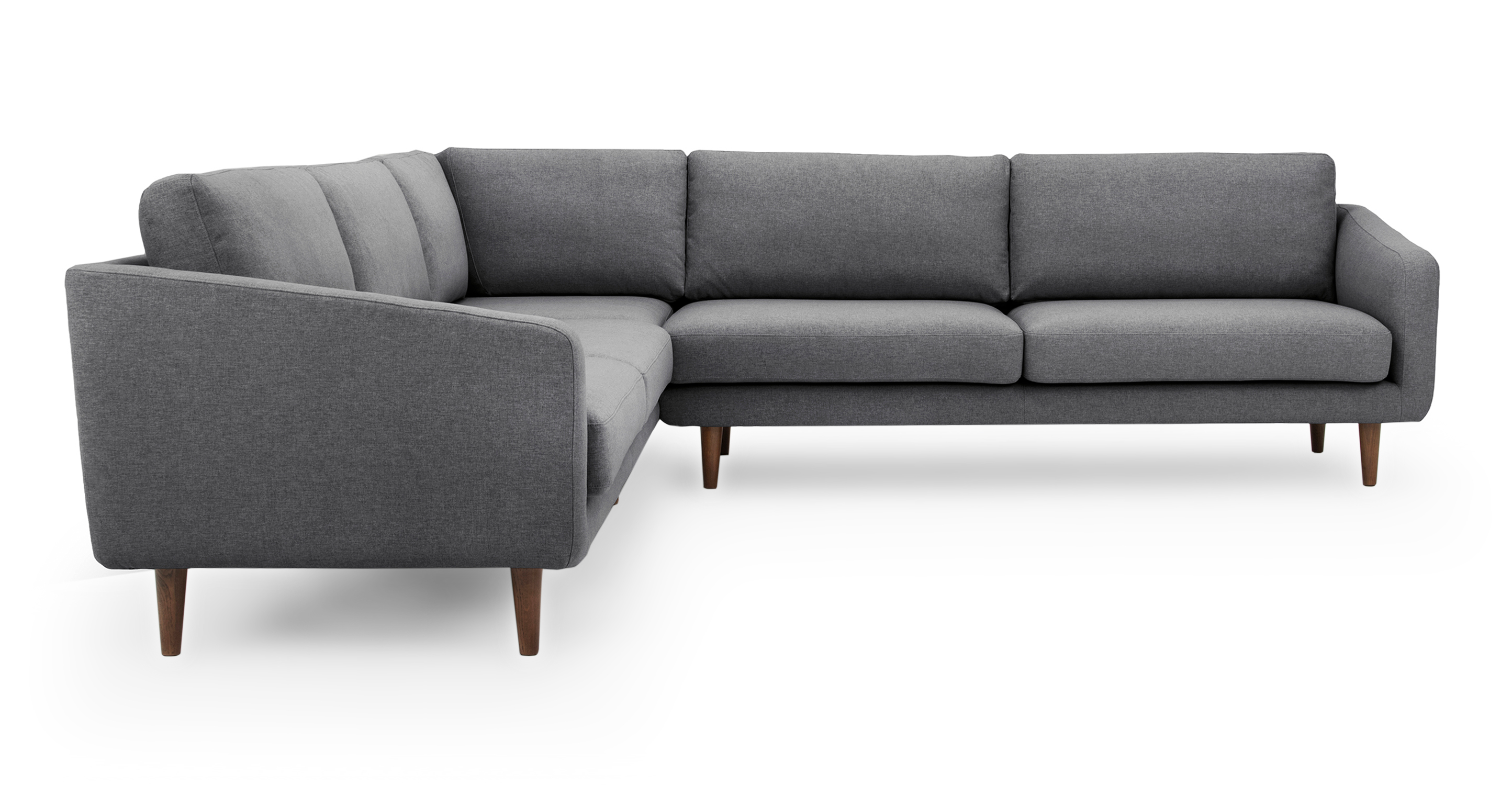 Burnham is a modern 3 piece corner sectional in dark grey fabric. The sectional is fully upholstered and has forward sloping arms. Both back and seat cushions are removable. The sectional is lifted on Walnut stained legs, creating space underneath for storage. (Facing side)