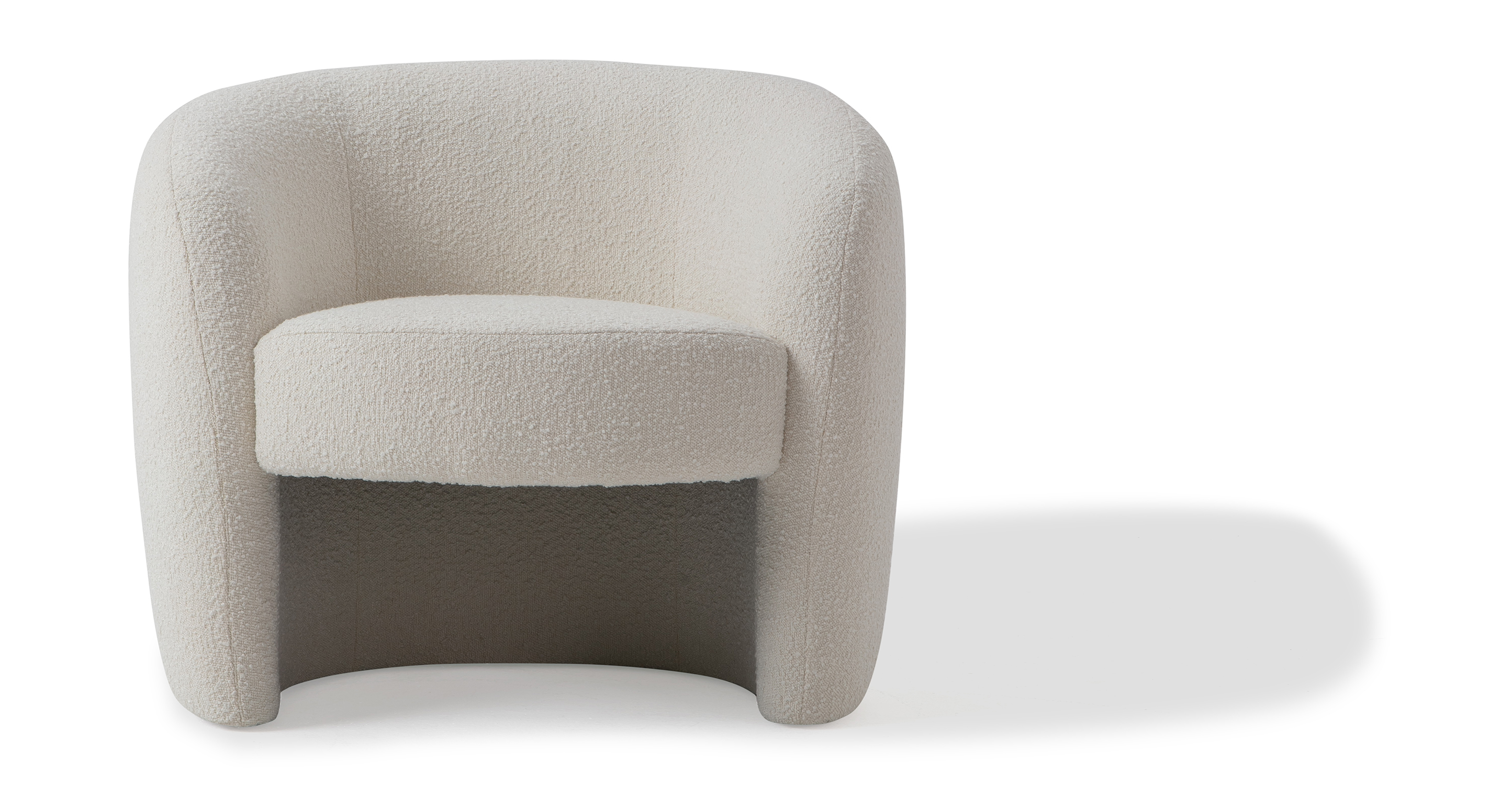 Blanc Miranda fully upholstered floor chair. Chair shape is a C shape with hollowed center. The seat is mounted to the back and sides of the chair and gives the illusion of floating. The chair is unique and modern.