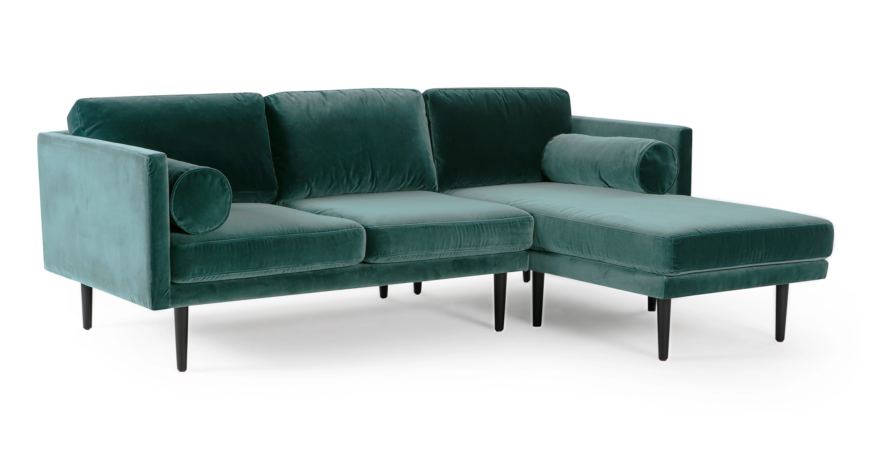 The Spectre Tranquil blue velvet Sectional is a timeless contemporary sofa that is 100% upholstered. It features a cohesive design with both the base frame and arms sharing the same thickness, resulting in a harmonious and consistent look. The sofa's portion has two seat and back cushions are removable and strike a balance between being well-cushioned and not overly stuffed. The chaise portion has one large seat cushion and one back cushion. To further enhance comfort, the Spectre includes two bolster pillows positioned on either side of the arm. The sofa is raised by tapered wooden legs.