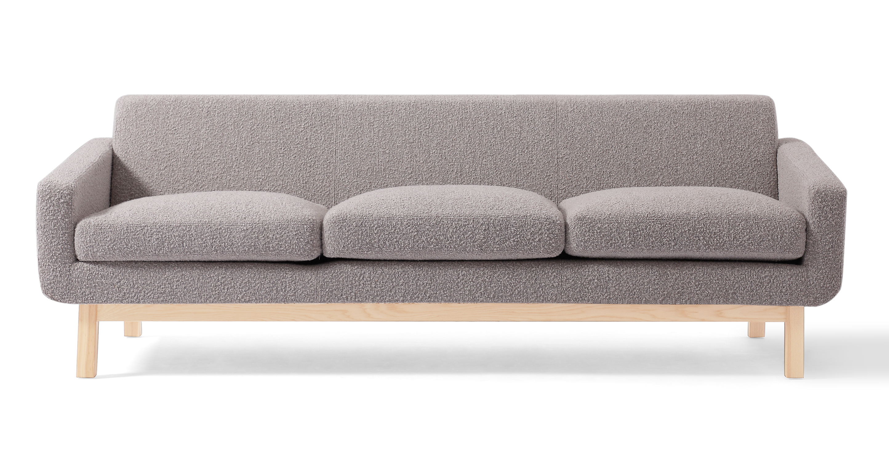 Platform sofa has an exposed natural wood frame, the back fame feet are angled sharper to create a relaxed decline. The back of the sofa is fixed and the three seat cushions are removable. The vibe is modern, simplistic, and classy.