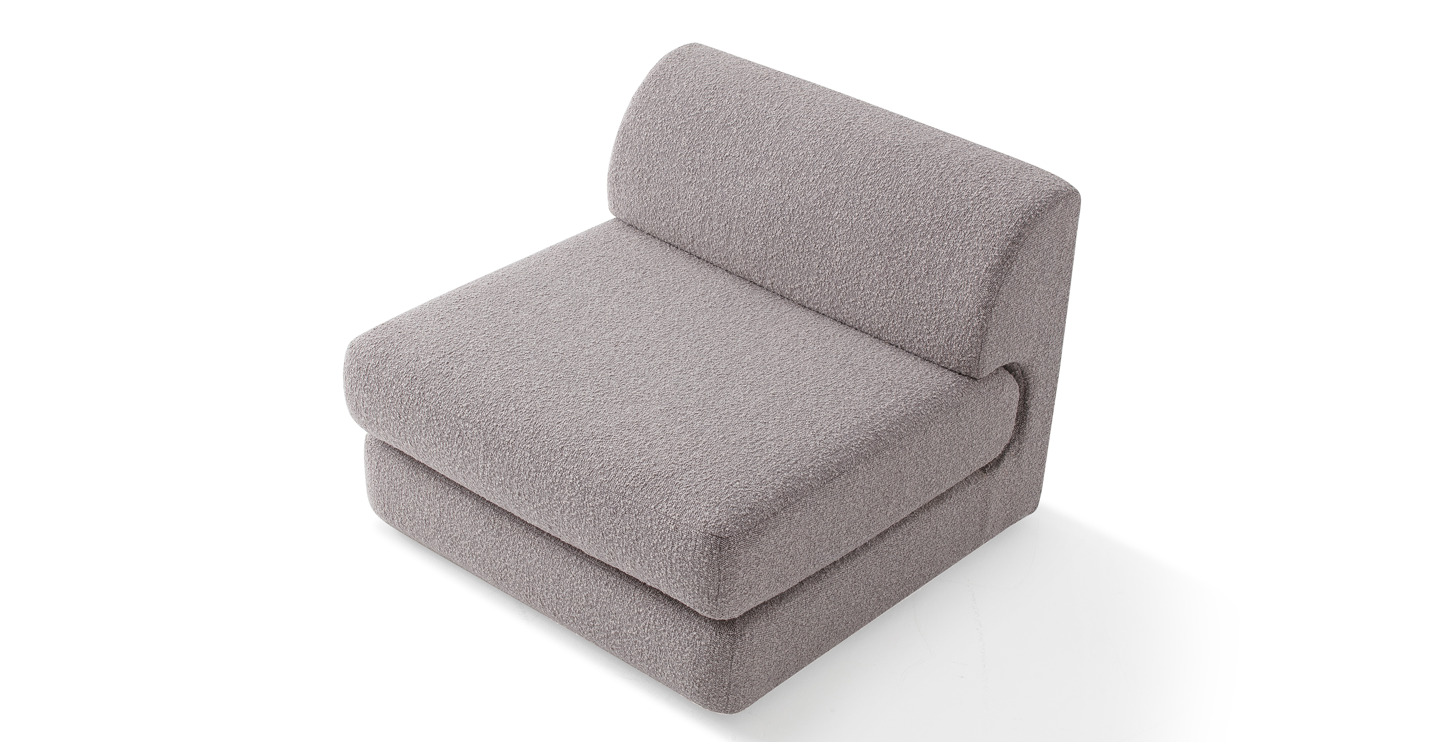 The Shelter series is a stunning and contemporary modular sofa with a sleek design, characterized by its low profile and elevated stance on slender black squared legs.
The Shelter seat cushion is curved at the back and fits into the chair back like a puzzle piece. Imaged is the armless Shelter chair in Bocce.