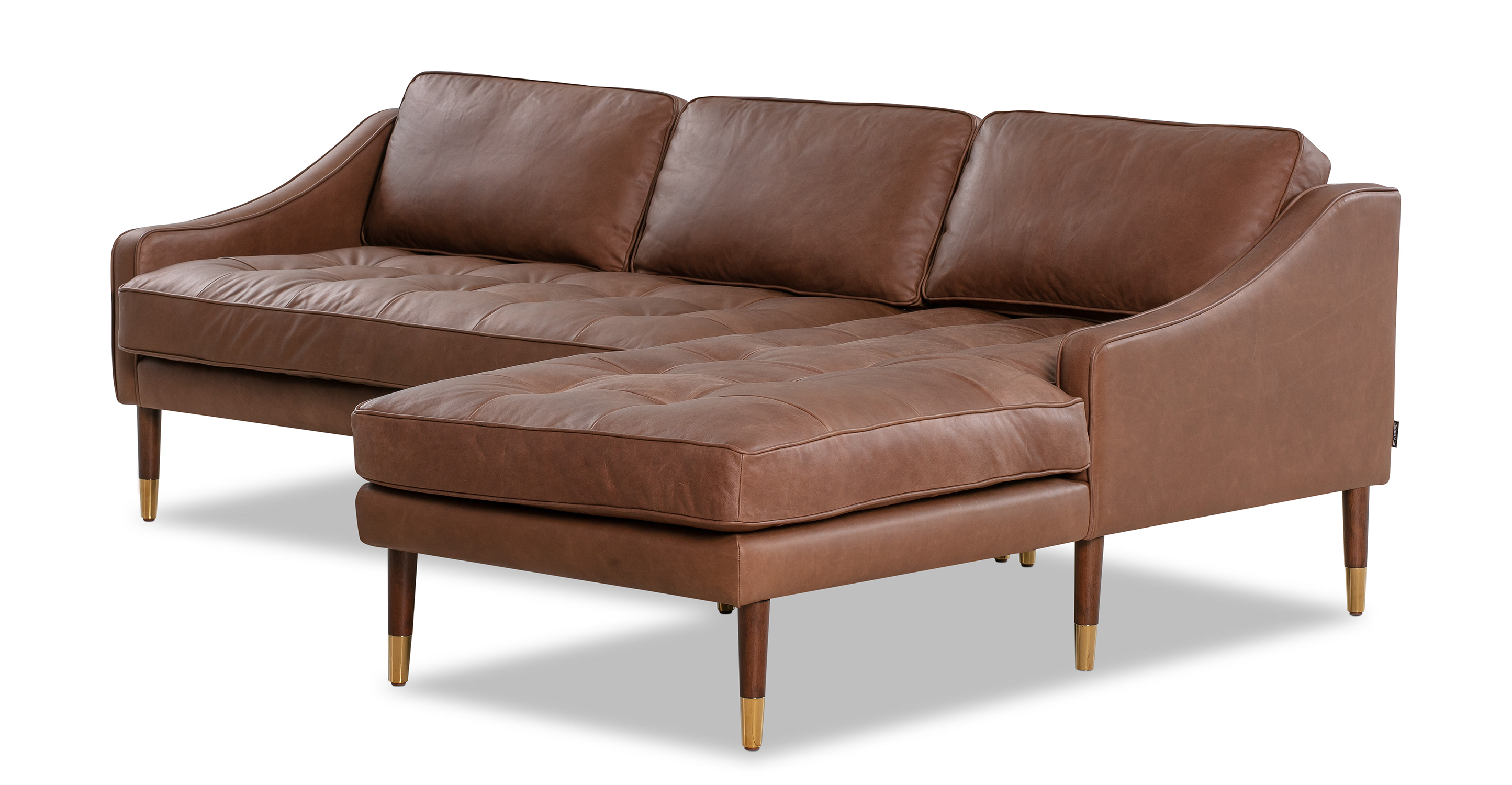 Brando is a modern sectional in brown leather. The chaise of the sectional, when you are facing the sectional, is on the right and the sofa portion is on the left. Walnut stained legs with gold tips toward the floor. The sofa fully upholstered and has swooping arms that taper from the back, down to the front. Both back and seat cushions are removable. The back cushion is smooth, the seat cushion is tufted. (facing front)