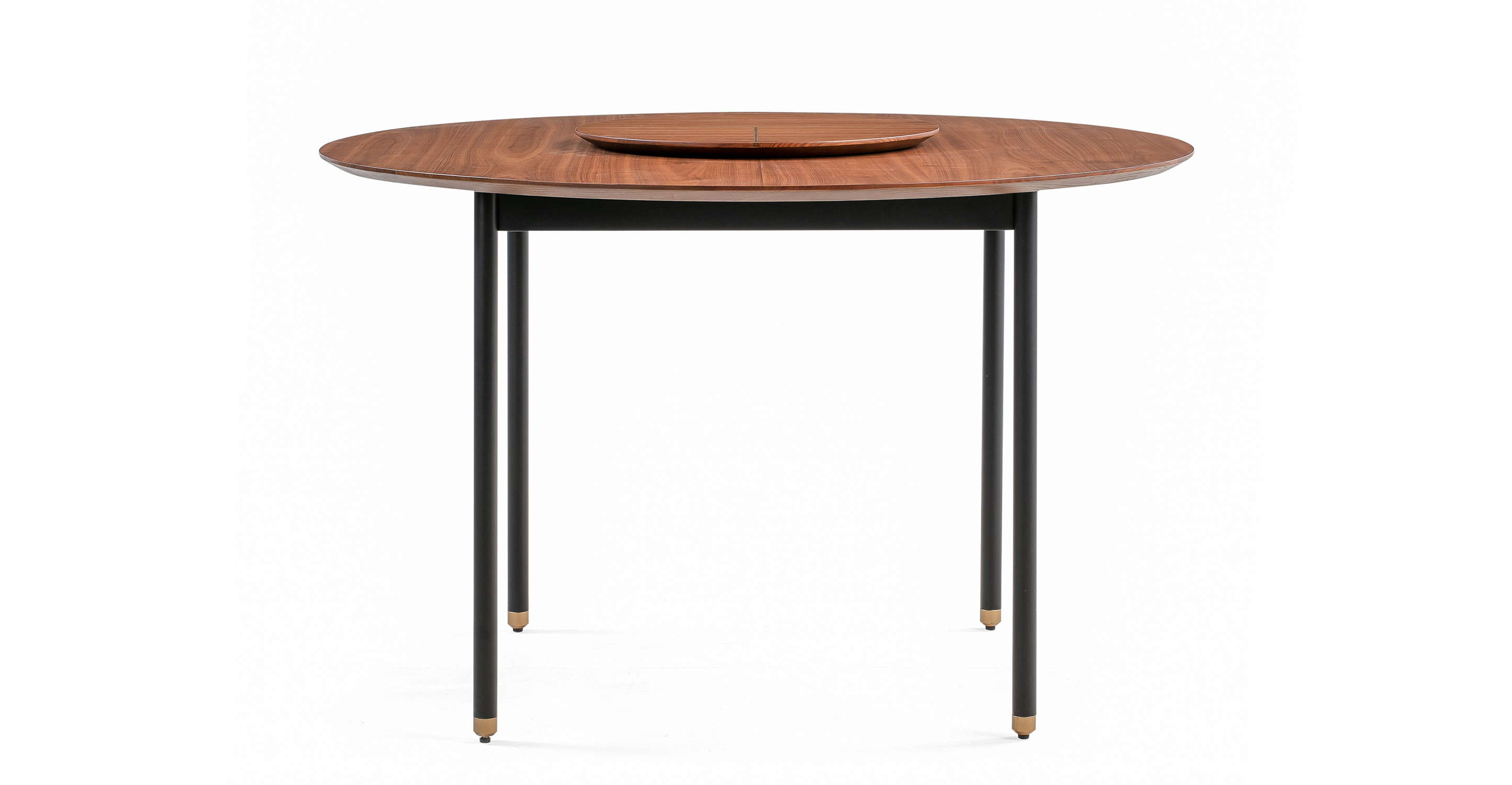 Urbane round modern table with walnut wooden round table with small center round elevated lazy susan. Black metal legs with walnut leg tips.