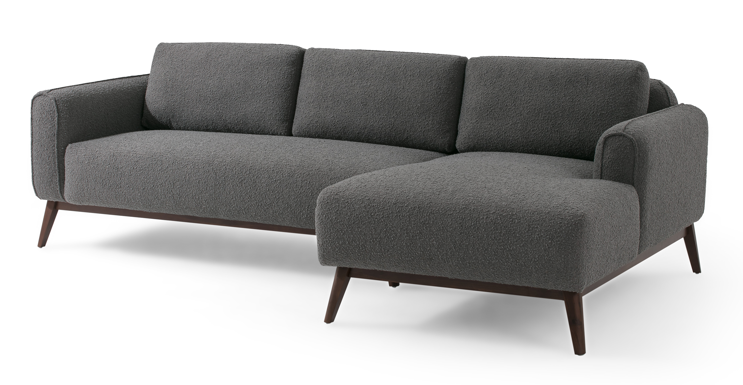 Gris Metro 4 sectional have full stuffed sofa appearance cushion. The arms, back, and seat cushions are affixed and 100% upholstery. Feel is modern and fun. The frame is exposed wood with slanted legs. 