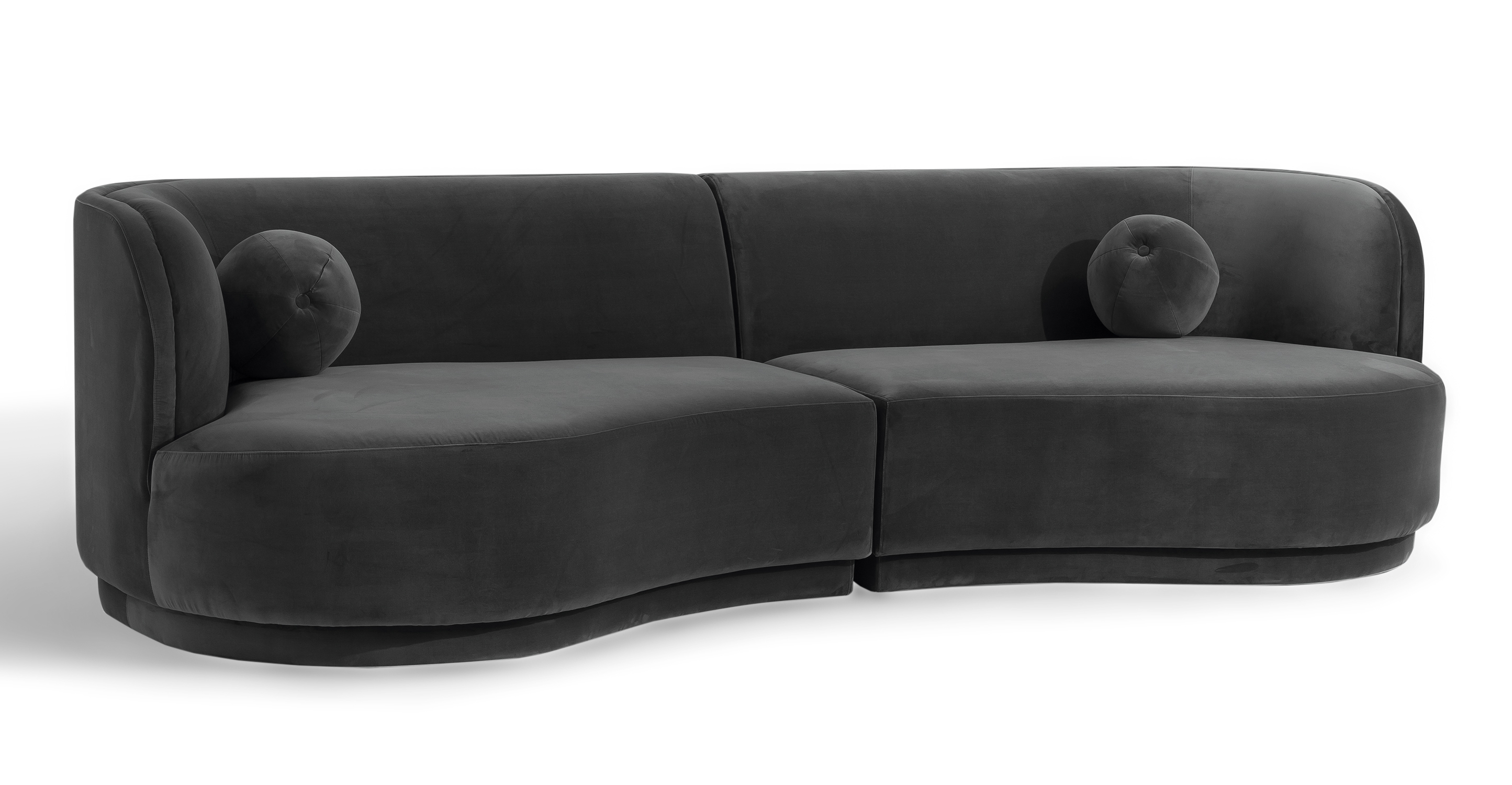 The Swoosh is a modular floor sofa series. A narrow indented frame supports the one-piece thick seat cushion. The back is attached and angled for nice lumbar support. On the loveseat pieces with arms, the shape of the arm is recessed and curved at the top. All the pieces have a curve to their shape - the more you add pieces, the more of a curve you get. The back is flat and smooth. Included with each piece is a matching round ball pillow. Solvang 2-pc Sofa, gray Fossil velvet set uses: One Swoosh left arm chaise, and one Swoosh right chaise.