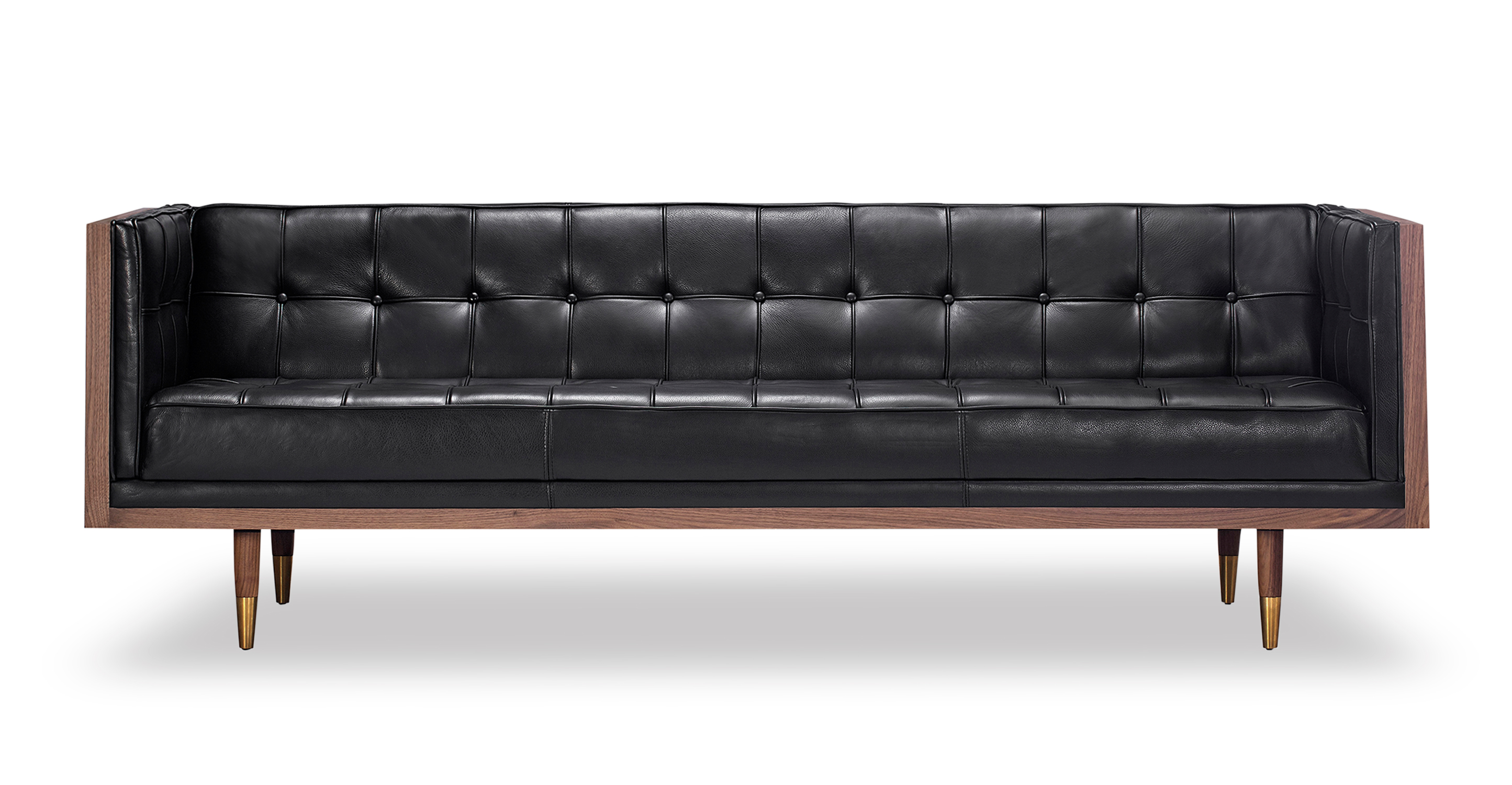 Woodrow 3 Seat Sofa in Black Leather has fixed seat and back cushions. There is button tufting on the back cushion, sides of the sofa and on the seat cushions. The frame and legs are walnut colored. The legs have brass colored ferrules on the ends. The back and outsides of the sectional are wooden. The leather color is black.