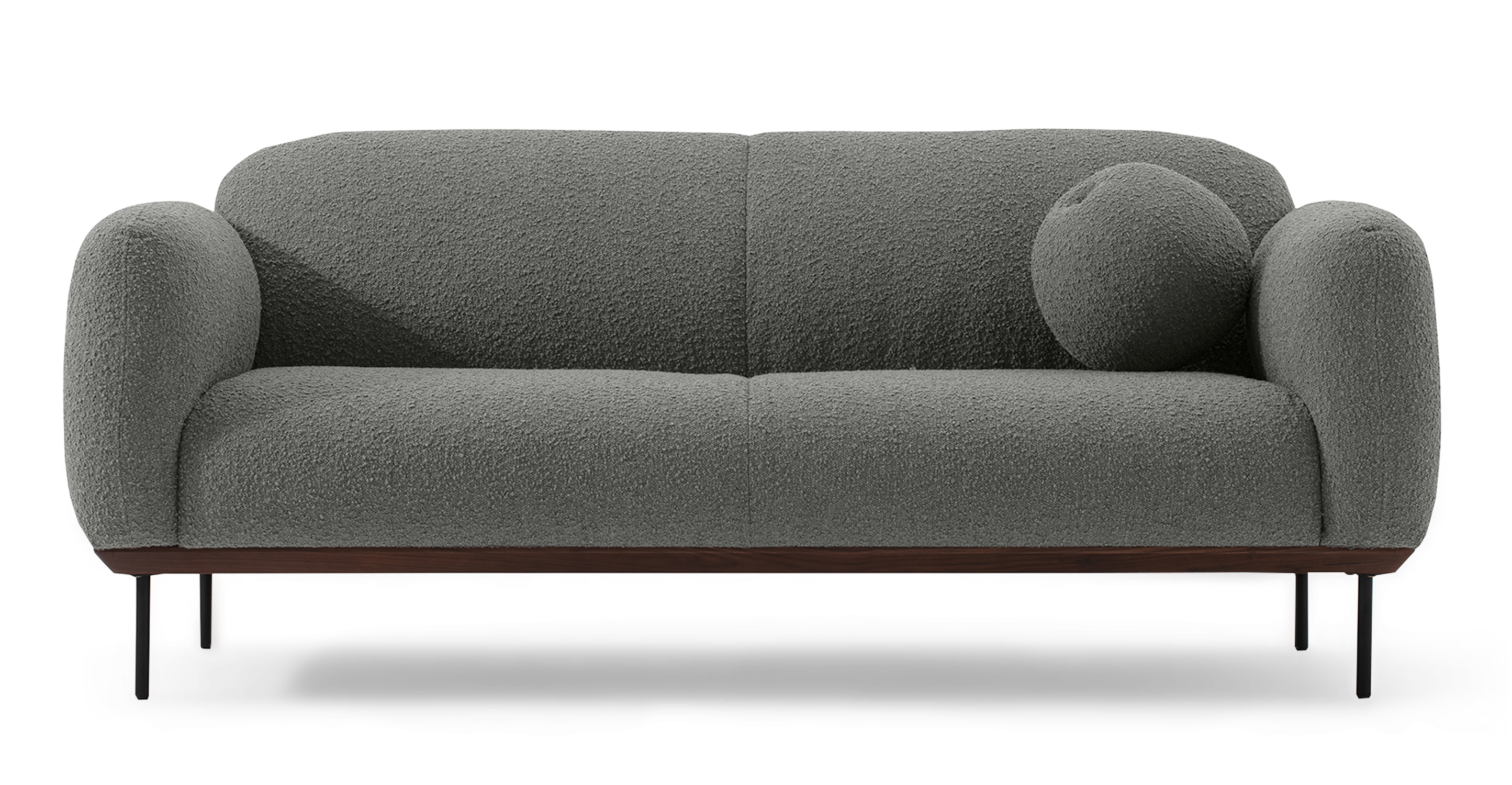 The Gris Puff love seat has respectfully cloud like overstuffed back, arms, and seat. The exposed frame is walnut and the legs are black metal. The cushions are affixed and have a seam in the center, creating the appearance of two back and seat cushions. One round throw pillow in Gris is included. 