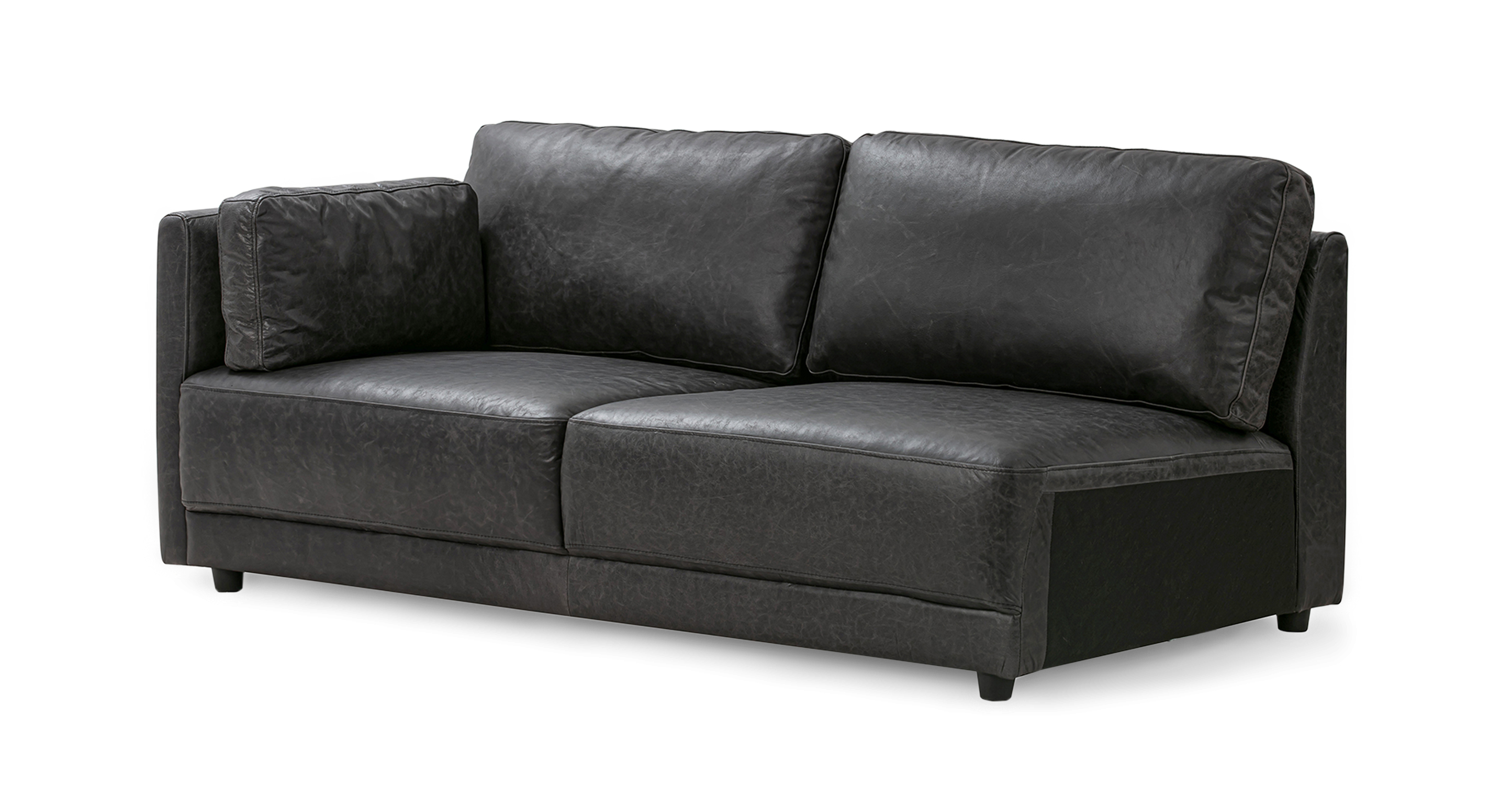 Ebony Domus Left Arm Sofa has one straight arm on the left when facing, two back cushions, two fixed seat cushions, and one throw. This item can be used alone or added as part of the Domus series. The Domus is a floor based series, fully upholstered with a thick attached seat cushion. The style is modern and minimalist.