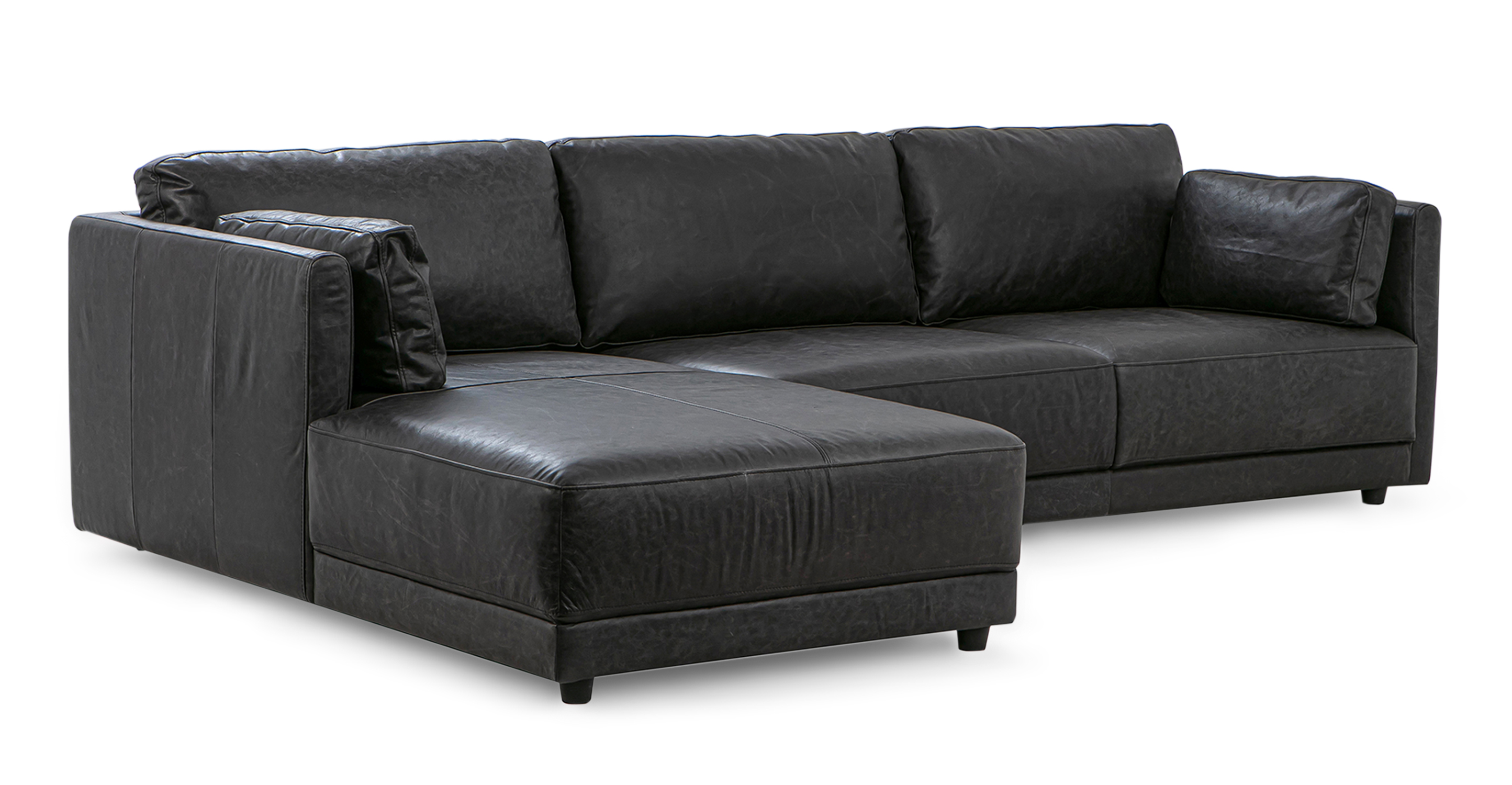Ebony Domus left sectional is a floor sectional with a chaise on the left (when facing the sectional) and a sofa option on the right. This sofa has removable back cushions, low profile arms, and is 100% upholstered. The style is modern and minimalist.