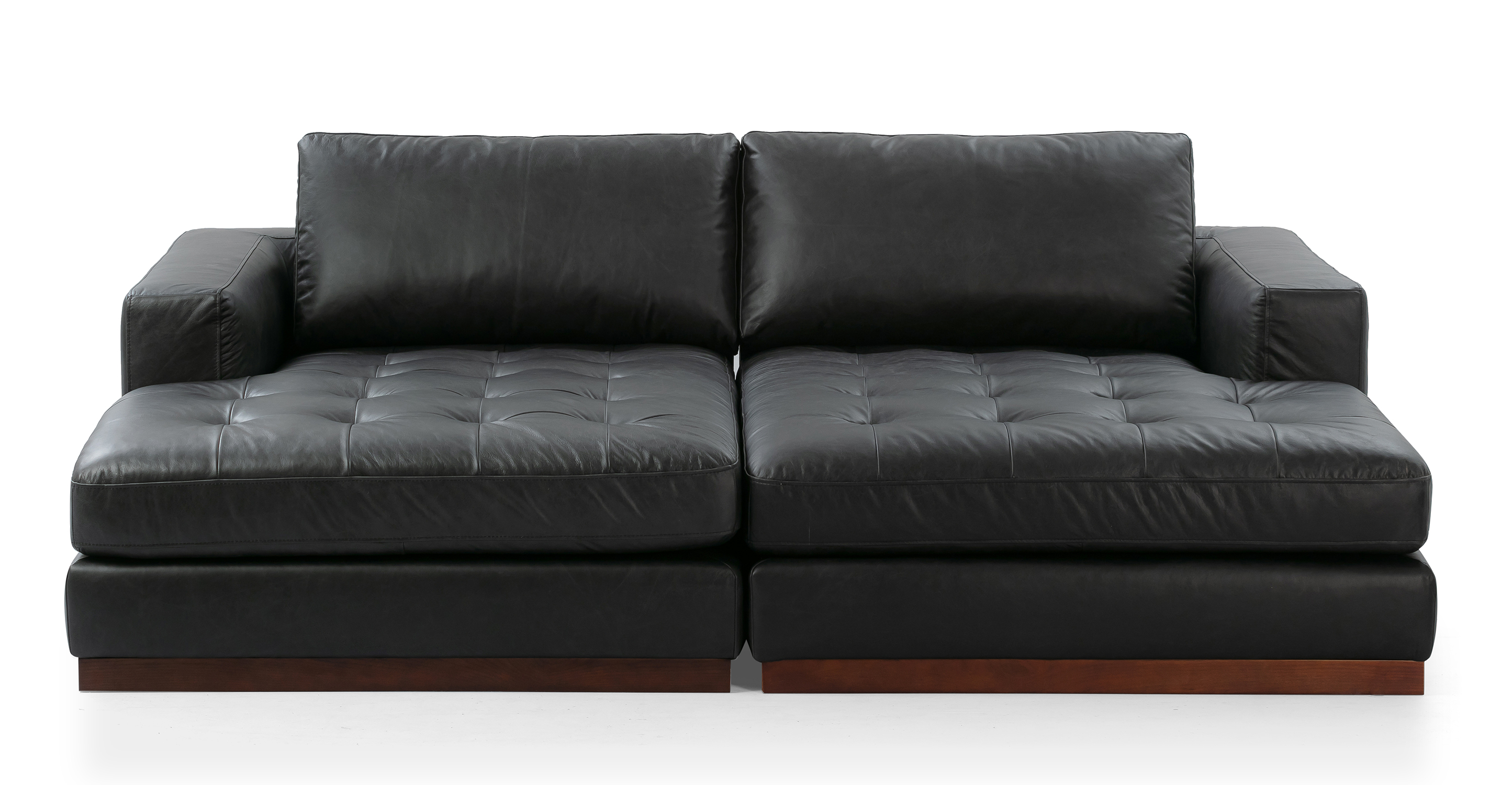 The Newport Ebony floor sofa series embodies a modern and substantial aesthetic, providing a solid and sturdy feel. The base of the sofa series is crafted from walnut wood, providing a stylish foundation. The modular design allows for flexibility in configuring the components to suit your preferences and space.
Each component of the series features an upholstered base that is attached to the wooden frame, combining both comfort and durability. The seat and back cushions are removable, allowing for easy customization and cleaning.
The arms of the sofa pieces are rectangular, providing a clean and contemporary aesthetic.
Double chaise lounge consists of two chaises together and creates a wide and long lounging experience.