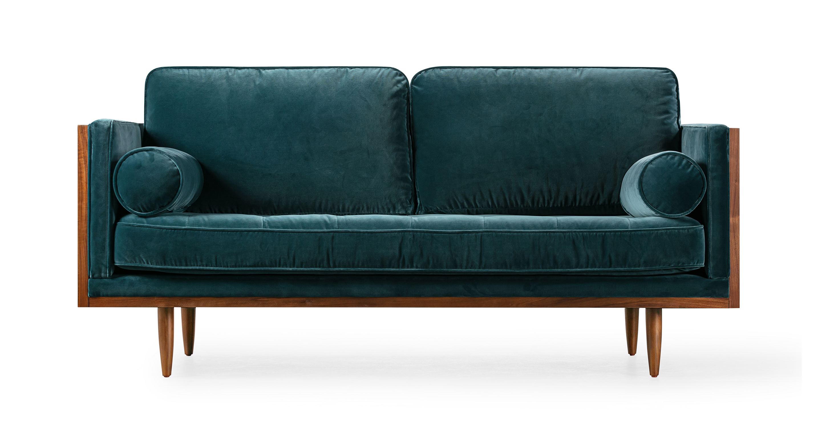 Image shows a front facing view of Woodrow Skandi Modern Classic Wood Wrapped Loveseat in Tranquil Cotton Velvet. Sofa has two cylindrical bolster pillows. There are two removable back cushions. There is one button tufted removable seat cushion. Legs are stiletto style. Frame and Legs are Walnut wood. 