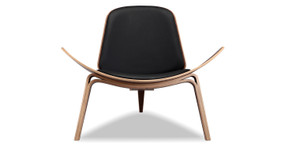 Image shows front view of Mid-Century Modern Tripod Lounge Chair in Black Italian leather. The chair has Walnut frame and legs. The chair has fixed cushions. The chair's seat curves upward on the sides.