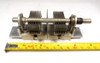 Dual-section air variable capacitor, 7–105 pF per section, approximately 1000 V peak rating. Compact multi-plate design with ~1/64-inch plate spacing and 1/4-inch shaft. Measures about 4-3/4 × 1-5/8 × 2-1/4 inches. Ideal for amateur radio receivers, restoration projects, or RF tuning applications needing matched ganged sections for simultaneous tuning.