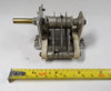 Wide-spaced single-section air variable capacitor, 9.5–12.5 pF, approximately 9000 V peak rating. Multi-plate design with ~1/4-inch plate spacing, ceramic insulators, and 1/4-inch shaft. Measures about 3-3/4 × 2-5/8 × 2-3/4 inches. Ideal for high-voltage RF applications, neutralizing circuits, amateur radio transmitters, or restoration projects needing a reliable low-capacitance high-voltage component.