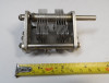 National dual-section air variable capacitor, 10–105 pF per section, approximately 1000 V peak rating. Compact multi-plate design with ~1/64-inch plate spacing and 1/4-inch shaft. Measures about 3-1/2 × 2-1/2 × 2-5/8 inches. Ideal for amateur radio receivers, restoration projects, or RF tuning applications needing matched ganged sections for simultaneous tuning.