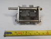 National dual-section air variable capacitor, 10–105 pF per section, approximately 1000 V peak rating. Compact multi-plate design with ~1/64-inch plate spacing and 1/4-inch shaft. Measures about 3-1/2 × 2-1/2 × 2-5/8 inches. Ideal for amateur radio receivers, restoration projects, or RF tuning applications needing matched ganged sections for simultaneous tuning.