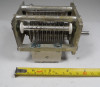 Unmarked single-section air variable capacitor, 21–71 pF, approximately 3000 V peak rating. Multi-plate design with ~1/16-inch plate spacing and 1/4-inch shaft. Measures about 4-1/2 × 2-3/4 × 2-1/2 inches. Ideal for amateur radio transmitters, antenna tuners, or RF projects needing a compact medium-voltage tuning capacitor.