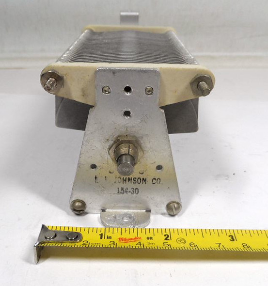 EF Johnson 154-30 Single Section Air Variable Capacitor – 21-1000 pF, 1500 Volt. Genuine E.F. Johnson compact Type E single air variable ideal for ham radio transmitters, amplifiers, and antenna tuners. High-capacitance design in rugged aluminum construction with steatite insulation, approx. 7″ L × 2⅝″ W × 2⅝″ H, ¼″ shaft. Clean used condition. Perfect for vintage restoration or medium-power RF loading projects. Nationwide Radio & Eq. Sales – ke9pq.com