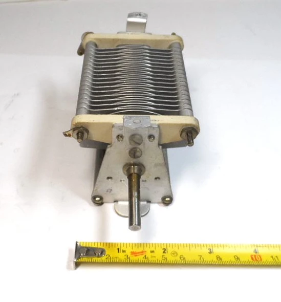 Genuine E.F. Johnson 350E20 single-section air variable capacitor. Capacitance approximately 17-360 pF (catalog 15-353 pF), ~0.045″ plate spacing, 2000 V peak rating. Compact Type E design with steatite insulation, aluminum plates, and ¼″ shaft. Ideal for ham radio, antenna tuners, amplifiers, transmitters, and RF projects. Dimensions approx. 5⅝″ L × 2⅝″ W × 2⅝″ H. Classic Waseca, MN quality. Clean used condition. Perfect for restoration or new builds needing reliable high-capacity air-variable tuning.
