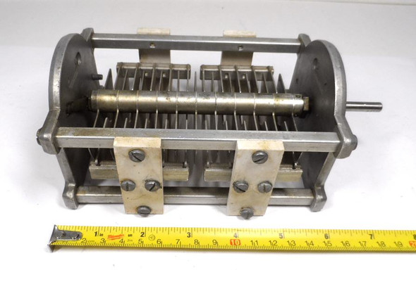 Hammarlund TCD-50-A dual section air variable capacitor, approximately 22-56 pF per section, rated about 7000 V. Heavy-duty transmitting style unit roughly 7-1/2 inches long with 1/4 inch shaft and wide .175 inch air gap. Ideal for high-power RF amplifiers, antenna tuners, and ham radio projects. Features ceramic insulation and robust construction from the classic Hammarlund TCD series. Quality vintage American-made variable capacitor for reliable high-voltage performance. Available from Nationwide Radio & Eq. Sales.
