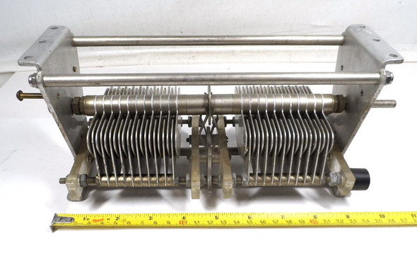 Bud 1623 dual section air variable capacitor, 18-250 pF per section, rated 2400 V with .070 inch air gap. Heavy-duty approximately 10-1/2 inch long transmitting style unit with 1/4 inch shaft and 21 plates per section. Ideal for high-power RF amplifiers, antenna tuners, and amateur radio projects. Quality vintage American-made Bud construction for reliable performance. Available from Nationwide Radio & Eq. Sales.