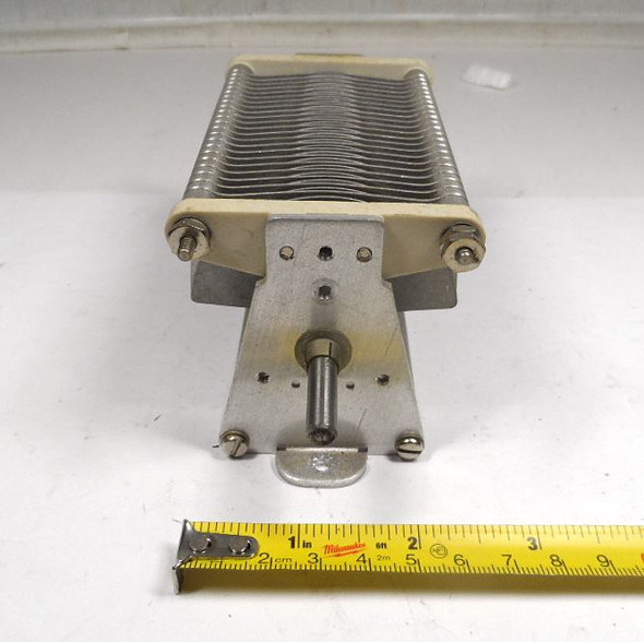 Cardwell 154-3-1 single-section air variable capacitor, 28–486 pF, 2 kV peak. Heavy-duty aluminum plates, 1/32-inch spacing, 1/4-inch shaft, ceramic ends. Ideal for ham radio transmitters, RF amplifiers, antenna tuners, and high-power tank circuits. Compact 2-5/8 × 2-5/8 × ~6-inch size with mounting brackets. Genuine Cardwell (E.F. Johnson Type E heritage). Clean used condition. Perfect for amateur radio builders seeking reliable high-voltage variable capacitance