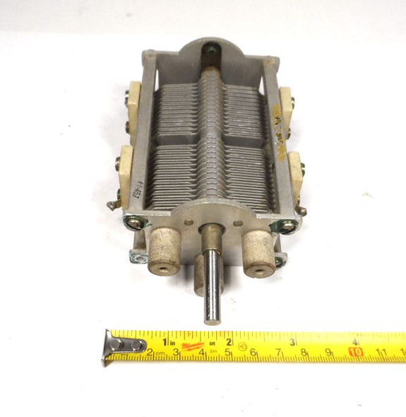 Vintage Hammarlund M457 dual-section air variable capacitor, 18–276 pF per section. Original Hammarlund Mfg. Co. construction with 1/64-inch plate spacing, 1/4-inch shaft, aluminum frame and ceramic insulators. Measures approximately 5½" long × 3¼" wide × 2" high. Approximately 1000 V peak rating based on air gap. Ideal for classic radio restoration, HF receivers, low-power transmitters, antenna tuners, or experimental RF projects. Smooth dual-bearing rotation, solder terminals on both sections. Excellent condition used part from a trusted source of vintage radio components. Perfect for boat-anchor builders and collectors seeking authentic Hammarlund quality.
