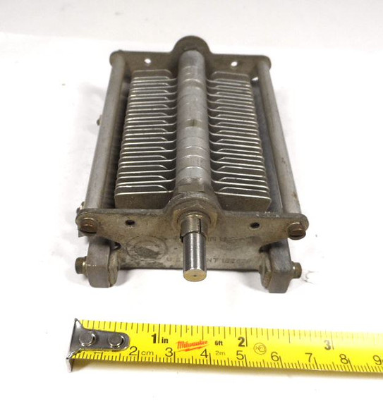 Vintage Cardwell 429-8 single-section air variable capacitor, 20–143 pF, approximately 1500 V peak rating. Classic USA-made multi-plate design with 1/4-inch shaft, ~1/32-inch plate spacing, and sturdy metal frame. Ideal for amateur radio transmitters, receivers, antenna tuners, or restoration projects. Measures about 4-3/4 × 3 × 2-1/4 inches. Solid condition for its age—perfect for ham radio builders seeking reliable RF tuning components.