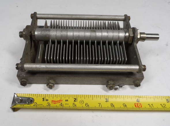 Vintage Cardwell 429-8 single-section air variable capacitor, 20–143 pF, approximately 1500 V peak rating. Classic USA-made multi-plate design with 1/4-inch shaft, ~1/32-inch plate spacing, and sturdy metal frame. Ideal for amateur radio transmitters, receivers, antenna tuners, or restoration projects. Measures about 4-3/4 × 3 × 2-1/4 inches. Solid condition for its age—perfect for ham radio builders seeking reliable RF tuning components.