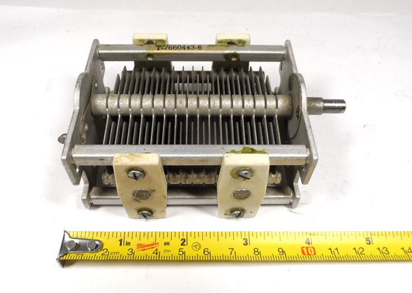Military surplus G.E. T7660443-6 single-section air variable capacitor, 23–160 pF, approximately 1500 V peak rating. Classic USA-made multi-plate design with ceramic insulators, 1/4-inch shaft, and ~1/32-inch plate spacing. Ideal for amateur radio transmitters, receivers, antenna tuners, or restoration projects. Measures about 4-3/4 × 3-1/2 × 2-1/4 inches. Solid condition for surplus gear—perfect for ham radio builders needing reliable RF tuning components.