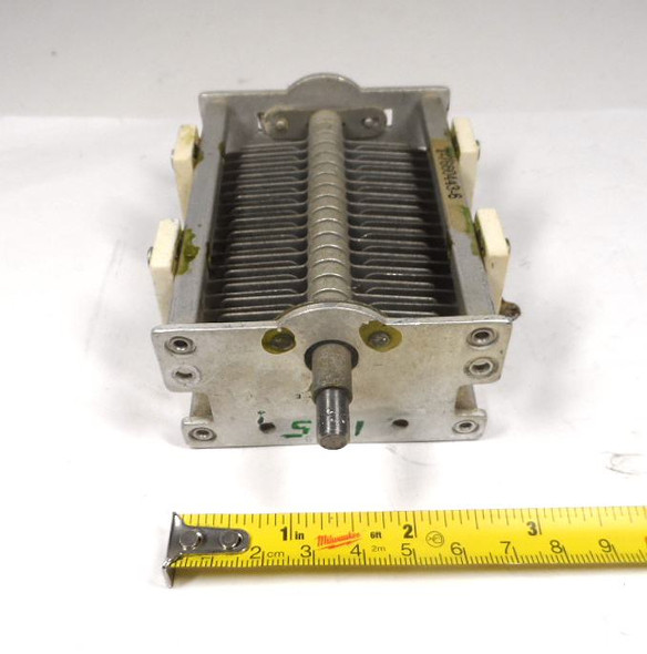 Military surplus G.E. T7660443-6 single-section air variable capacitor, 23–160 pF, approximately 1500 V peak rating. Classic USA-made multi-plate design with ceramic insulators, 1/4-inch shaft, and ~1/32-inch plate spacing. Ideal for amateur radio transmitters, receivers, antenna tuners, or restoration projects. Measures about 4-3/4 × 3-1/2 × 2-1/4 inches. Solid condition for surplus gear—perfect for ham radio builders needing reliable RF tuning components.