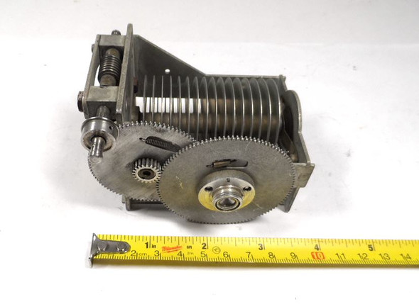 Military surplus model 7321 single-section air variable capacitor, 30–150 pF, approximately 2500 V peak rating. Features built-in worm gear reduction drive with right-angle shaft for precise RF tuning. Classic USA-made multi-plate design with ~1/16-inch plate spacing and 3/16-inch shaft. Measures about 4 × 3-3/8 × 2-5/8 inches. Ideal for amateur radio transmitters, receivers, antenna tuners, or restoration projects needing fine adjustment and reliable high-voltage performance.