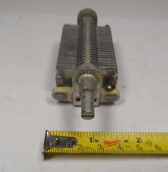 EF Johnson Single-section air variable capacitor model 962, 15–305 pF, approximately 1000 V peak rating. Compact multi-plate design with ceramic insulators, ~1/64-inch plate spacing, and 1/4-inch shaft. Measures about 4-1/4 × 1-3/4 × 1-3/4 inches. Ideal for amateur radio receivers, restoration projects, or RF tuning applications needing a reliable high-capacitance component in a small frame.