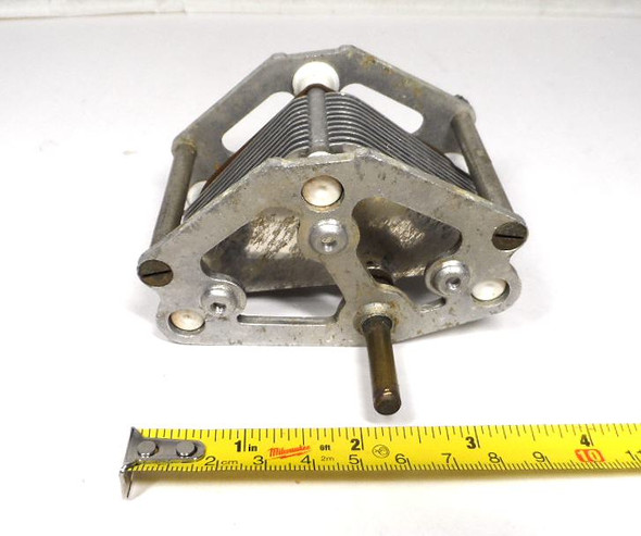 Vintage Reliance Die & Stamping three-section air variable capacitor, 24–500 pF per section, approximately 1500 V peak rating. Classic multi-plate design with ceramic insulators, ~1/32-inch plate spacing, and 1/4-inch shaft. Measures about 3-3/4 × 3-1/4 × 4 inches. Ideal for amateur radio receivers, restoration projects, or RF tuning applications needing matched triple-ganged sections for simultaneous tuning.