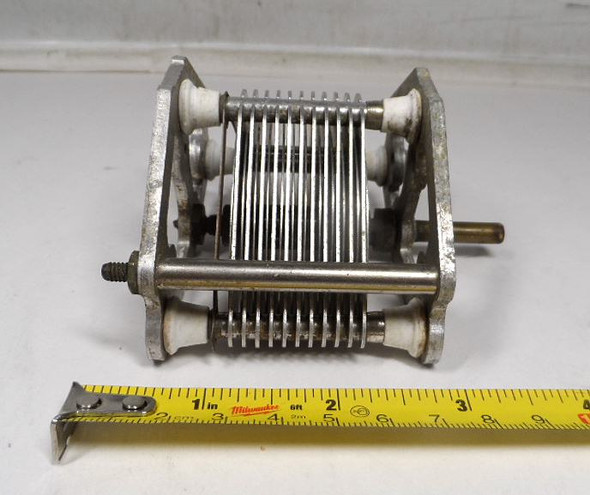Vintage Reliance Die & Stamping three-section air variable capacitor, 24–500 pF per section, approximately 1500 V peak rating. Classic multi-plate design with ceramic insulators, ~1/32-inch plate spacing, and 1/4-inch shaft. Measures about 3-3/4 × 3-1/4 × 4 inches. Ideal for amateur radio receivers, restoration projects, or RF tuning applications needing matched triple-ganged sections for simultaneous tuning.