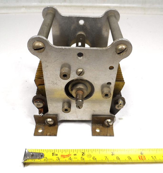 Unmarked single-section brass-plate air variable capacitor, 23–562 pF, approximately 1000 V peak rating. Compact multi-plate design with ~1/64-inch plate spacing and 1/4-inch shaft. Measures about 3-1/2 × 3-1/2 × 3-7/8 inches. Ideal for amateur radio receivers, restoration projects, or RF tuning applications needing a high-capacitance low-voltage component.